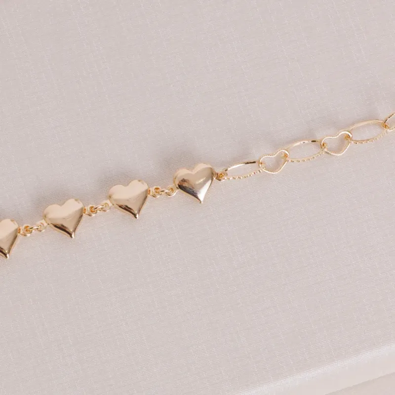 PULSEIRA CORAÇÃO VASADO E LISO BANHADO A OURO 18K