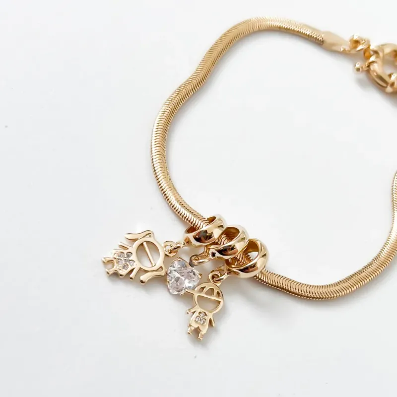 PULSEIRA FILHOS CASAL COM CRISTAL BANHADO A OURO 18K
