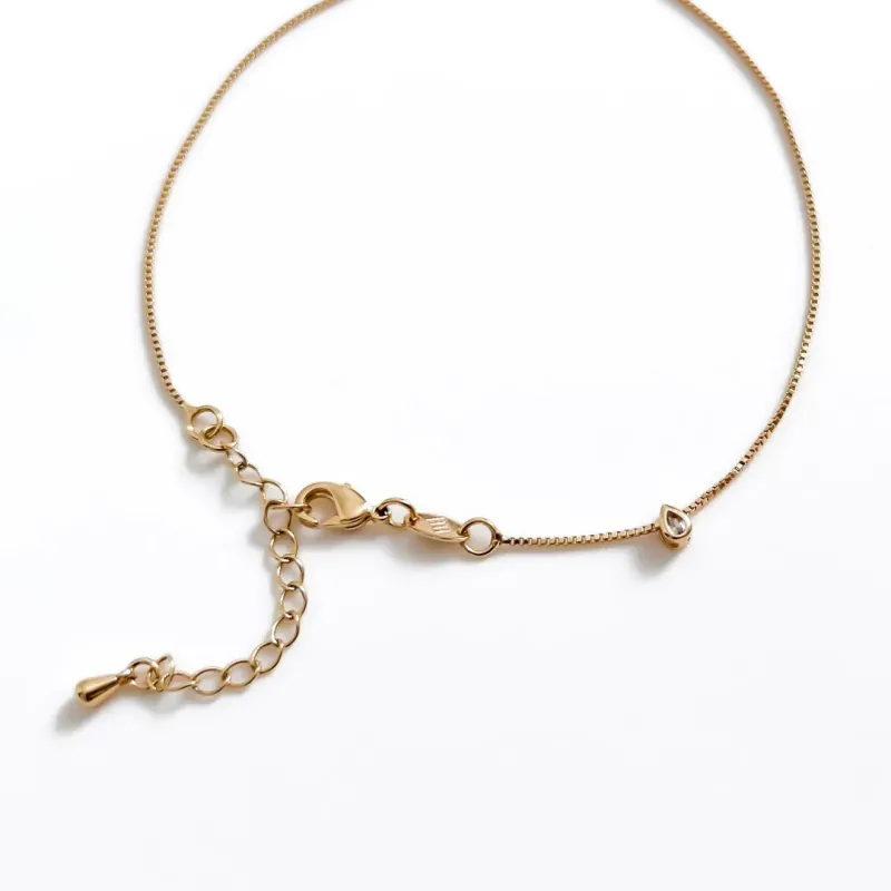 TORNOZELEIRA COM PINGENTE MINI GOTA BANHADO A OURO 18K