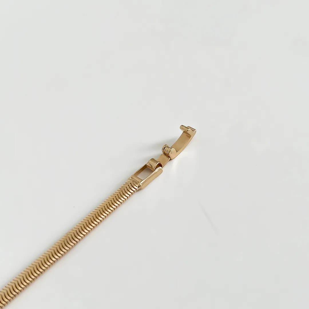 PULSEIRA PALITO COM ZIRCÔNIA BAGUETE COLOR BANHADO A OURO 18K