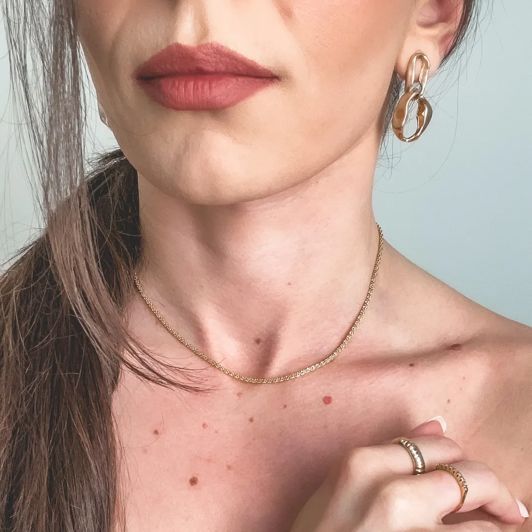 BRINCO TORCIDO BANHADO A OURO 18K