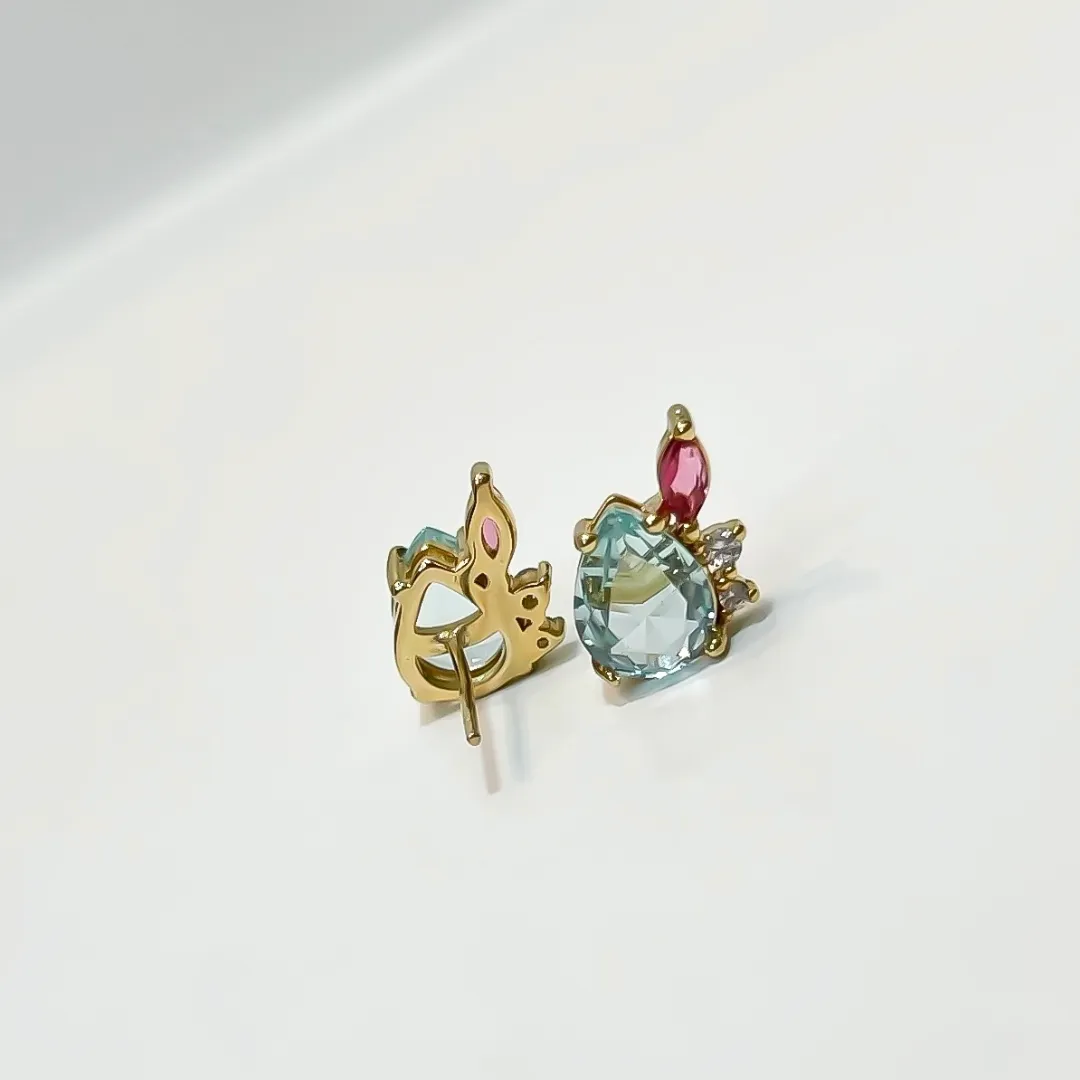 BRINCO CRISTAL AZUL COM ZIRCONIA ROSA BANHADO A OURO 18K