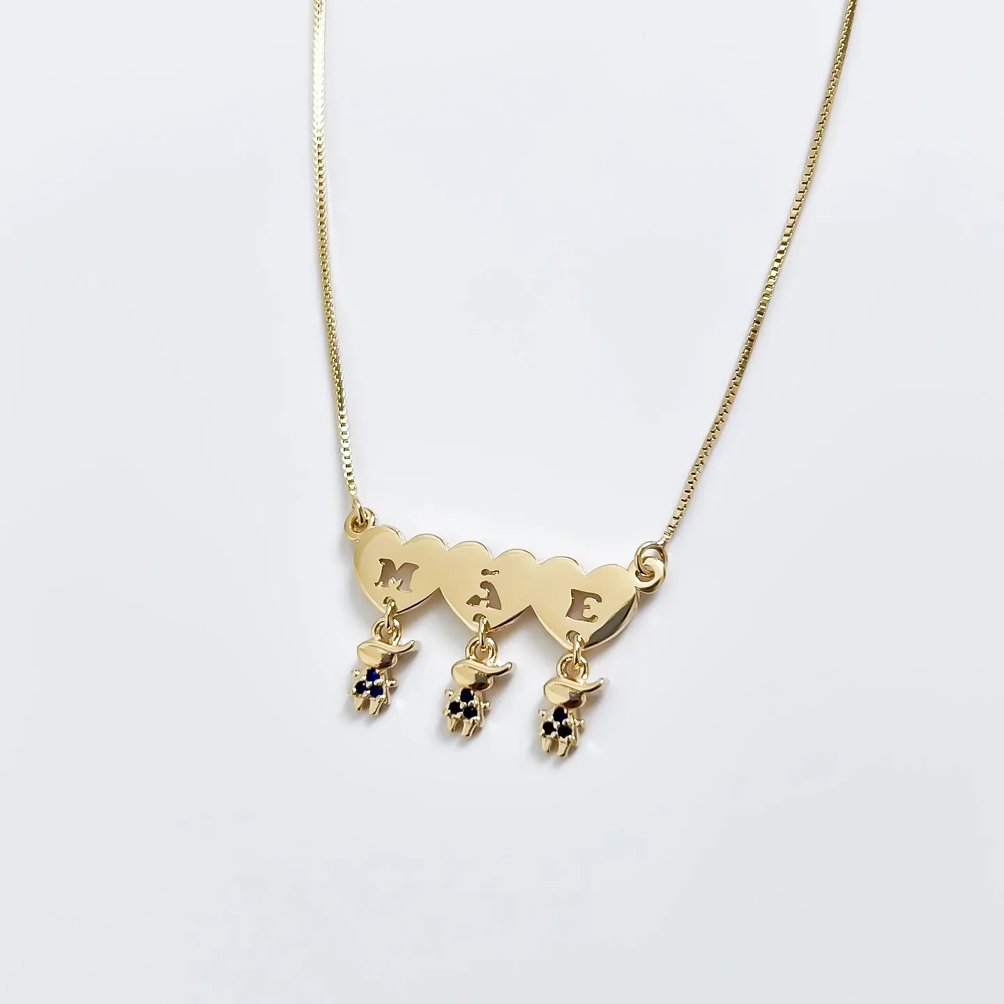 Colar Mãe de três Meninos com cristal azul banhado a ouro 18K