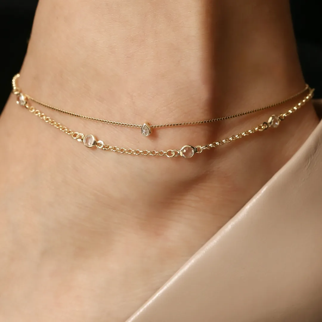 TORNOZELEIRA COM PINGENTE MINI GOTA BANHADO A OURO 18K